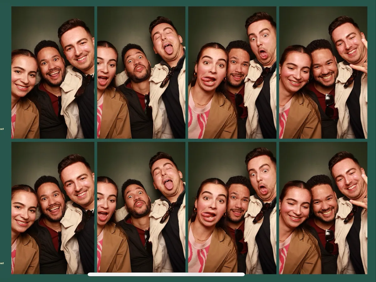 Klaudio, Derick, and a friend having fun in a photo booth
